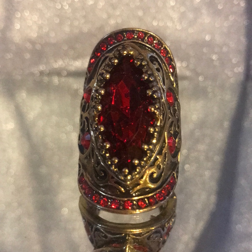 Red simulated antique brass stretch ring